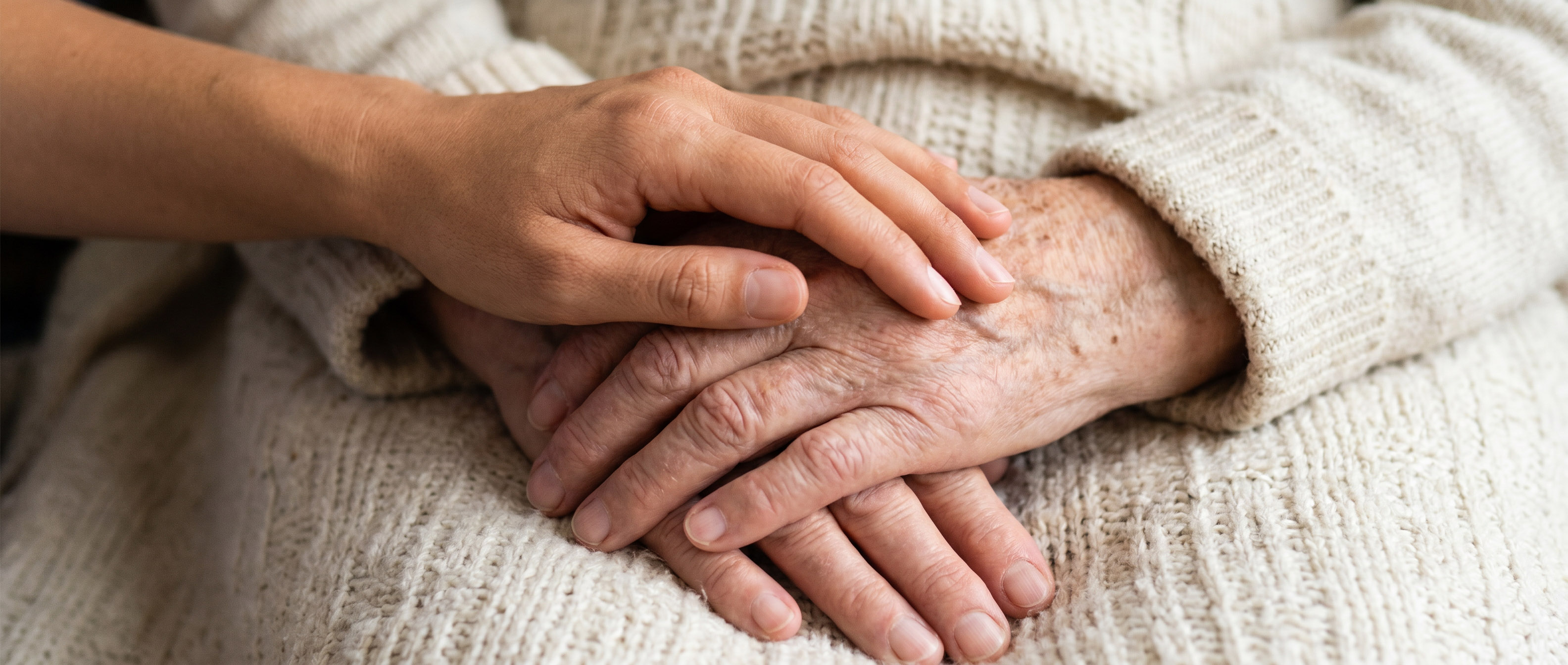 Close up of comforting hands